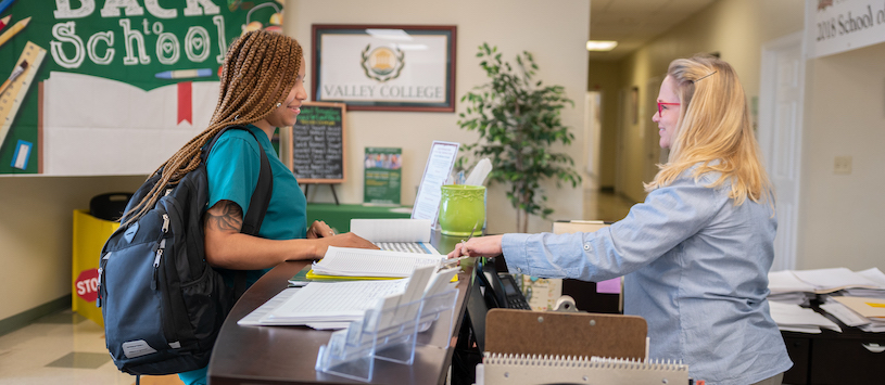 Valley College student being guided by an Admissions Advisor.